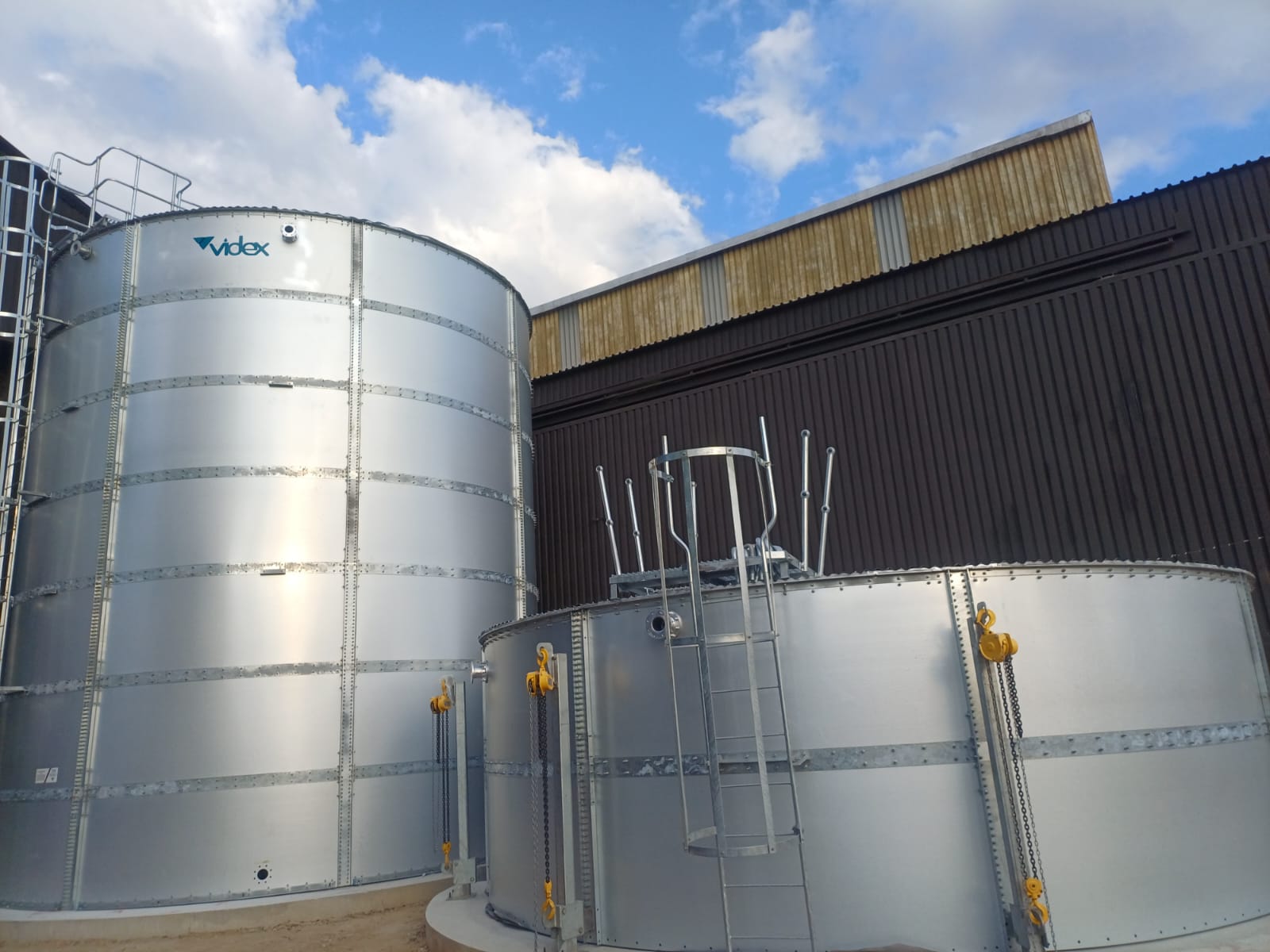 Completed Turffontein fire water tanks alongside existing industrial building